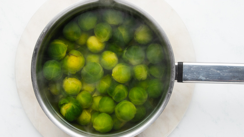 Brussels sprouts boiling in a pan