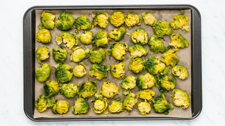 Smashed Brussels sprouts on a baking sheet