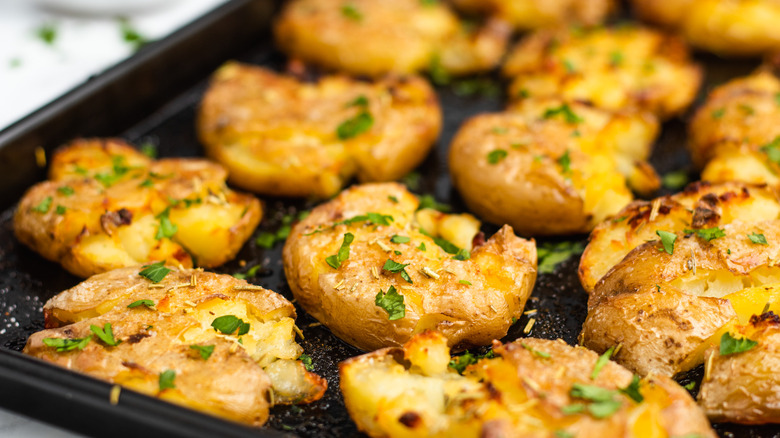 smashed potatoes on baking sheet 