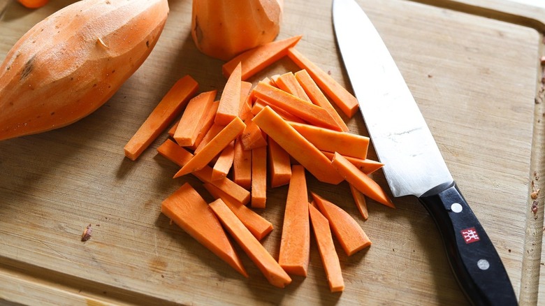 sweet potatoes on cutting board