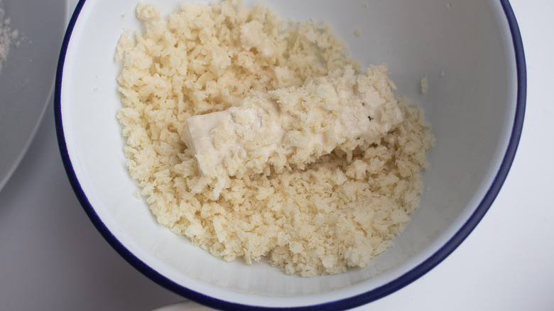 dredging tofu in panko in bowl