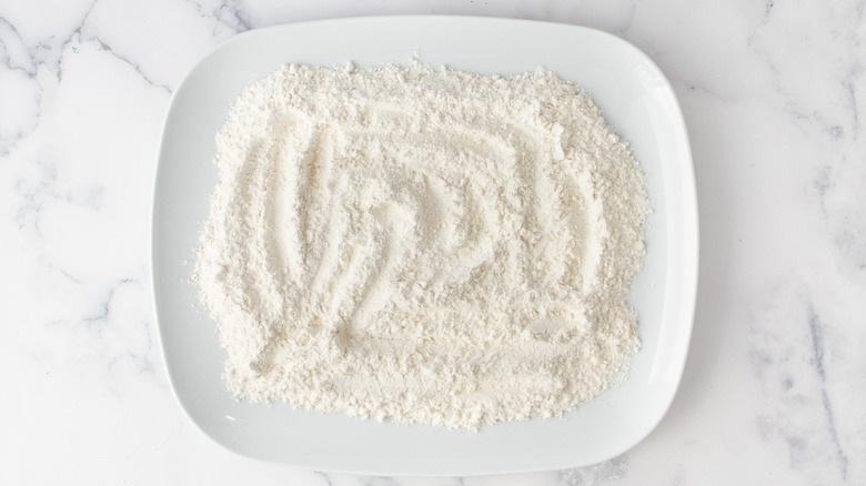 flour in a rectangular white bowl