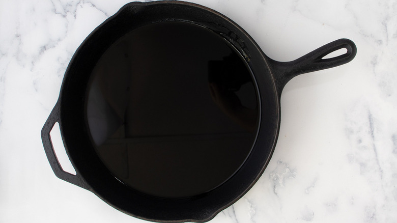 oil in a black cast iron frying pan