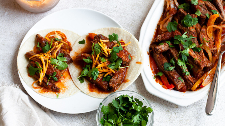 Beef fajitas on tortillas