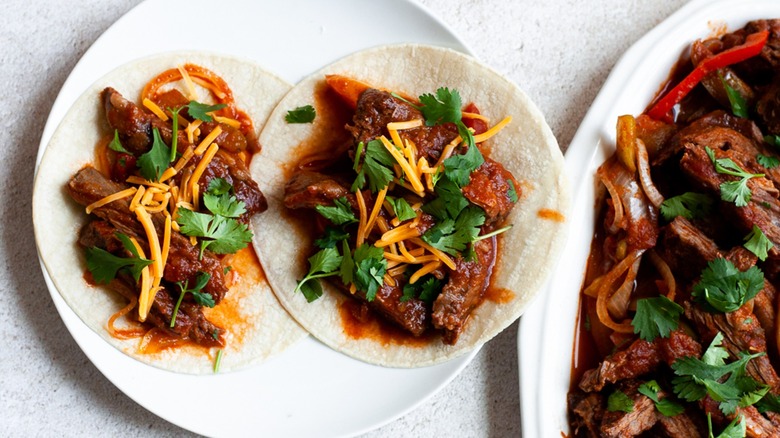 beef in sauce on tortillas