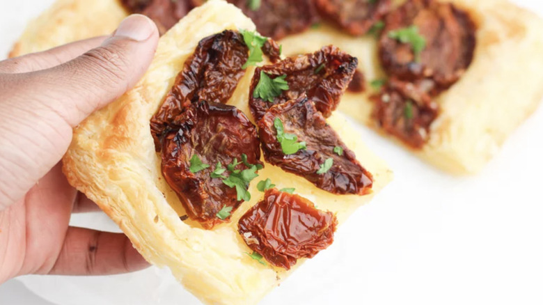 3-Ingredient Tomato Tart in hand