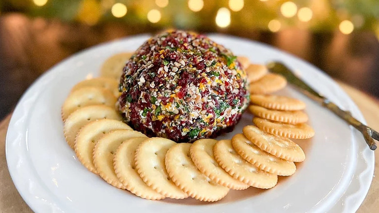 cranberry orange cheese ball surrounded by crackers