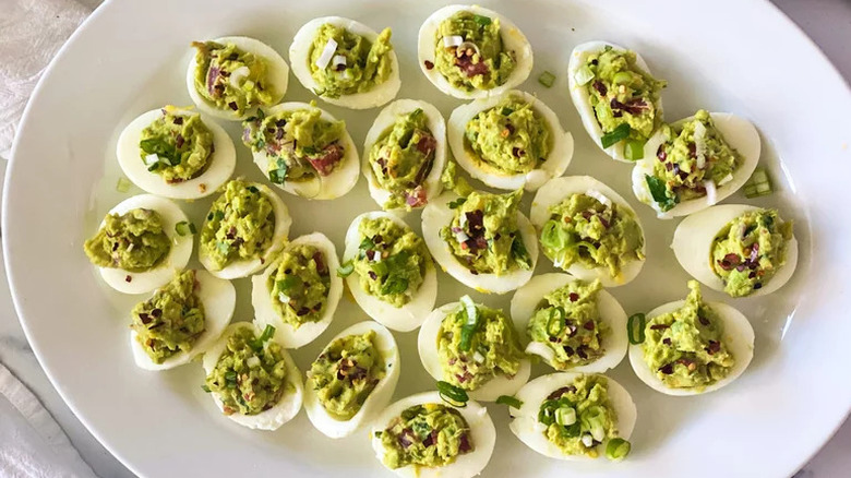 plate of guacamole deviled eggs