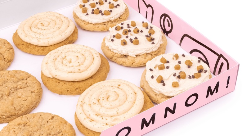 assortment of Crumbl Cookies in pink box