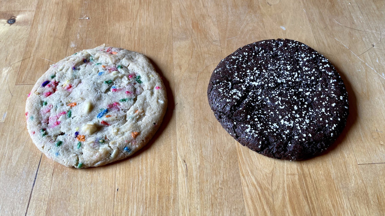 Sprinkle cookie next to a chocolate cookie