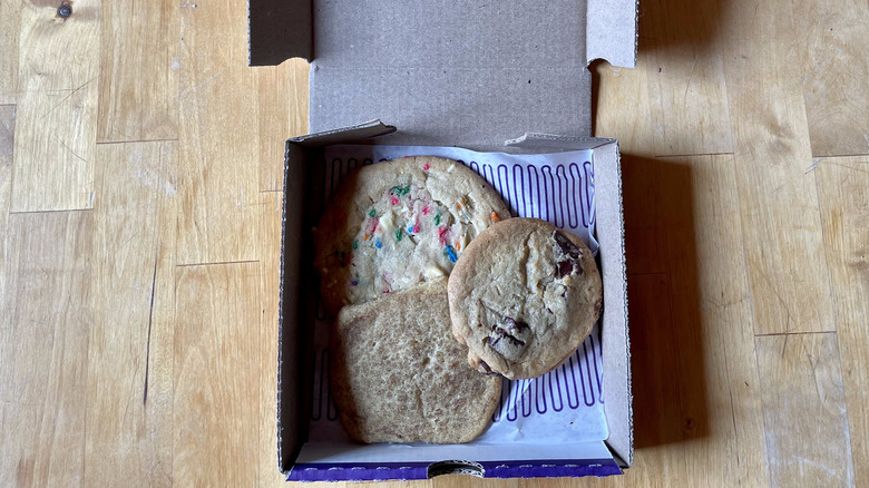 three cookies piled in a box