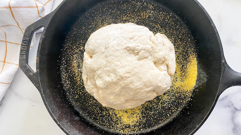 cast iron skillet with dough