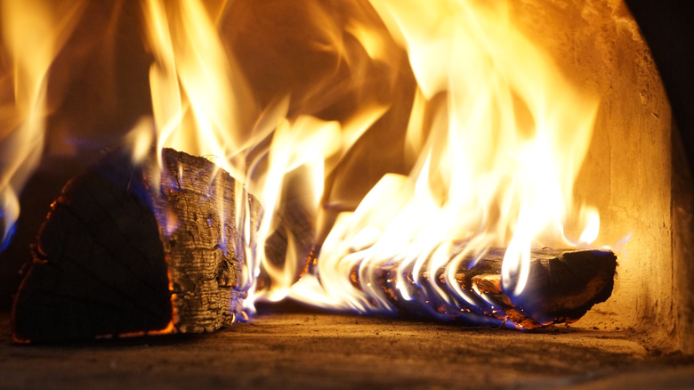 wood on fire in wood fired oven