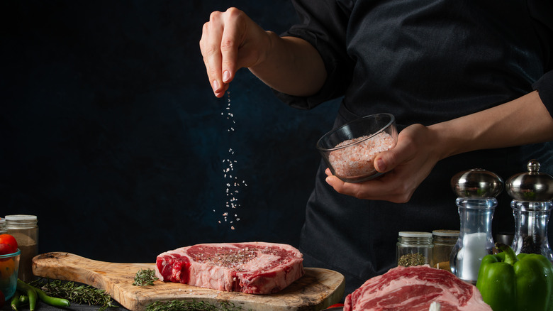 Seasoning steak with salt