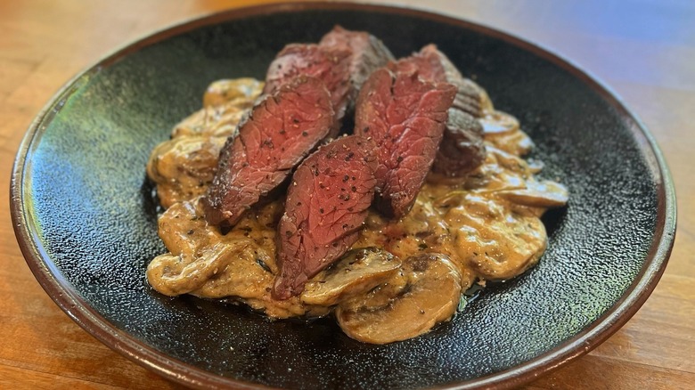 hanger steak with cooked mushrooms