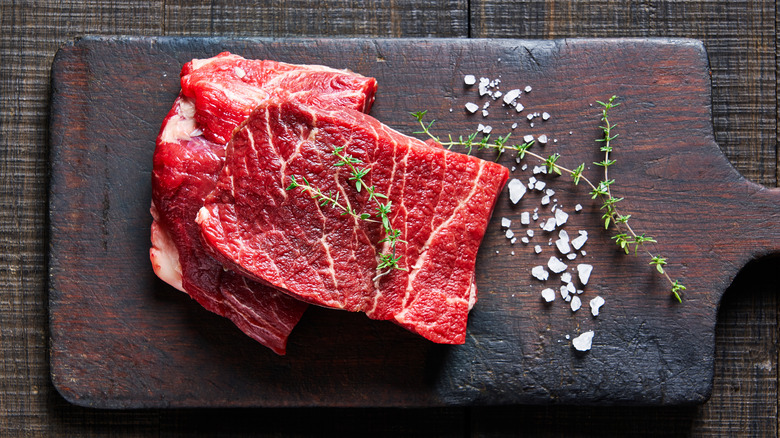 Flat iron steak on cutting board