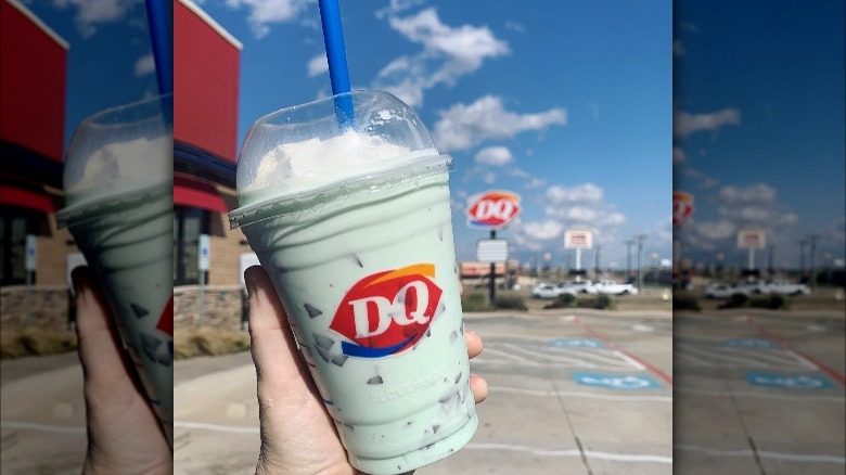 Person holding a Dairy Queen mint chip shake