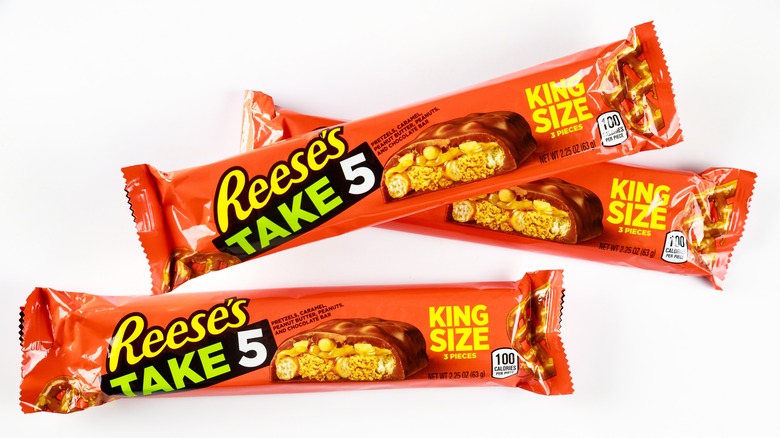 two wrapped Reese's take 5 candy bars on a white background