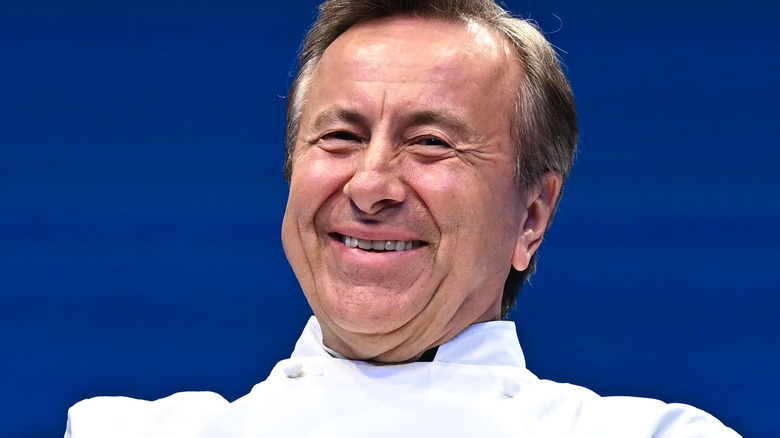 Daniel Boulud smiling in chef's coat