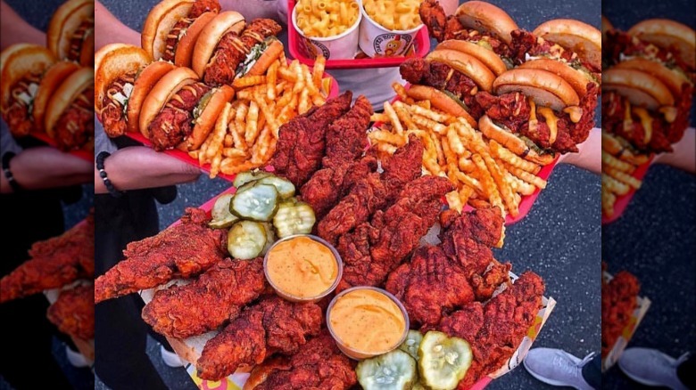 Trays of Dave's Hot Chicken food