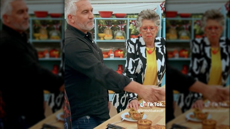 Paul Hollywood shaking David Schwimmer's hand