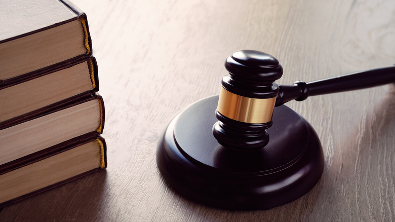 gavel on a desk next to stack of books