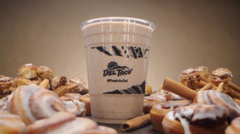 del taco cinnamon roll shake on a table with cinnamon rolls