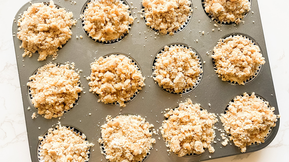 uncooked muffins with crumble topping