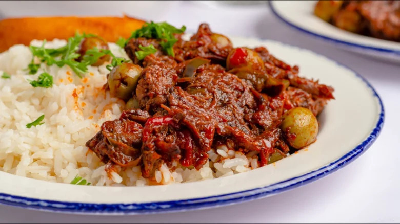 plate of ropa vieja with olives