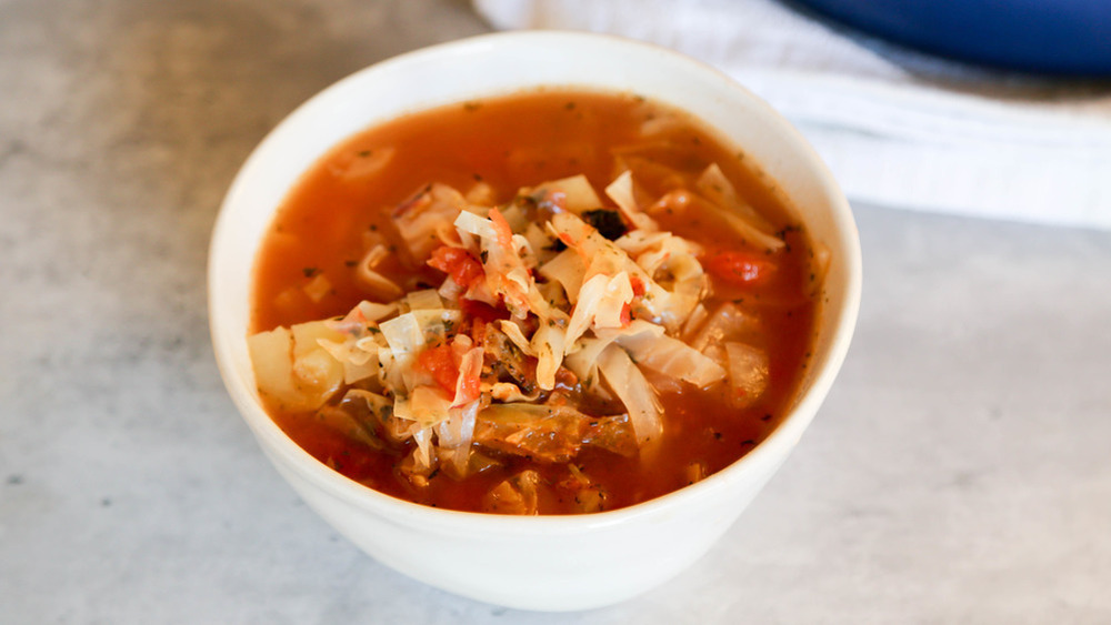 Cabbage soup in white bowl