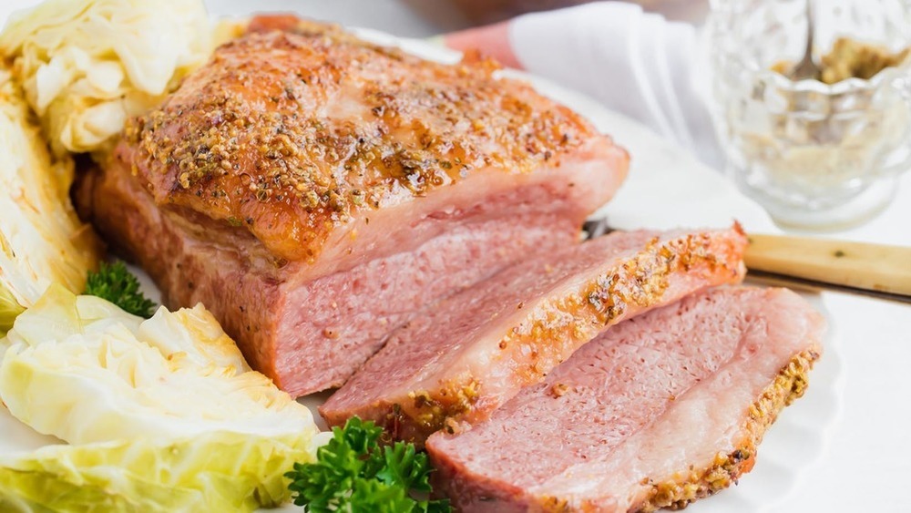 Sliced corned beef and cabbage on a white dish