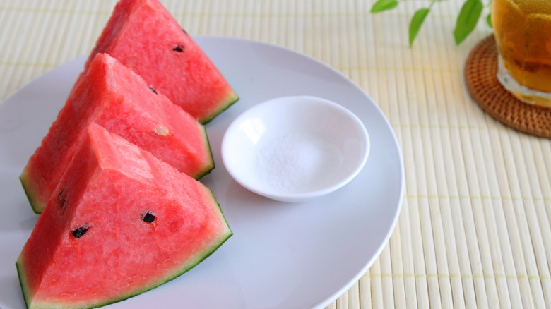 sliced watermelon with table salt