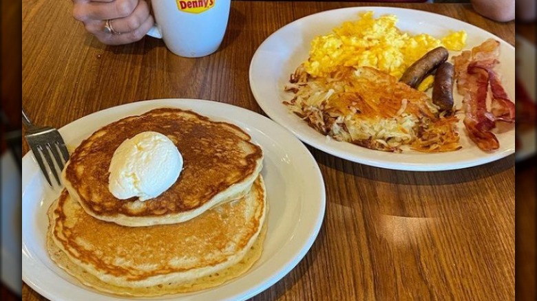 Eggs bacon sausage hash browns and pancakes