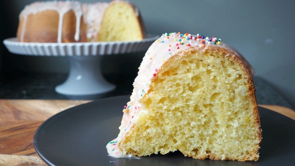 slice of frosted vanilla cake