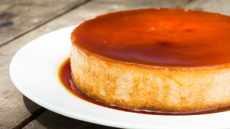 large caramel flan on plate