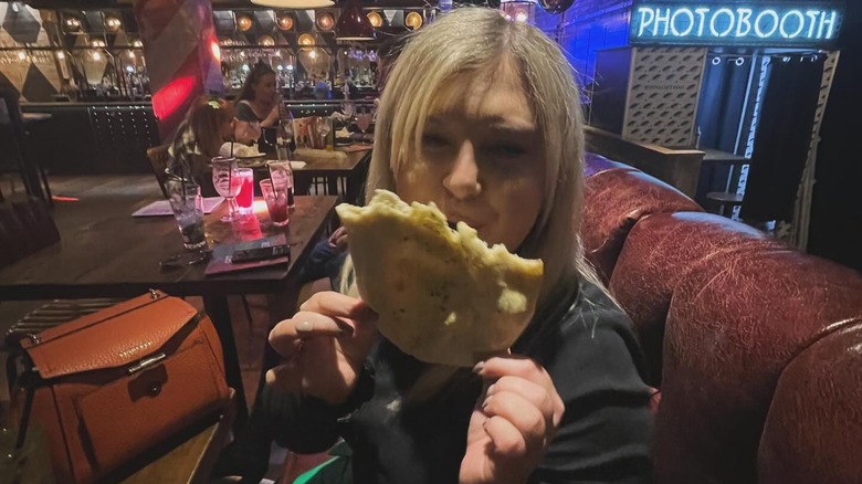 Lindsey Wood holding garlic bread