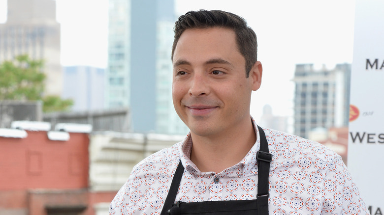 Jeff Mauro wearing an apron