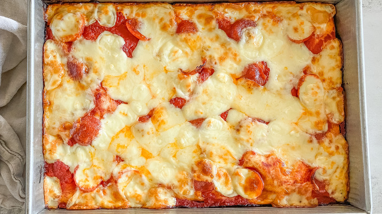 cheesy unbaked pizza