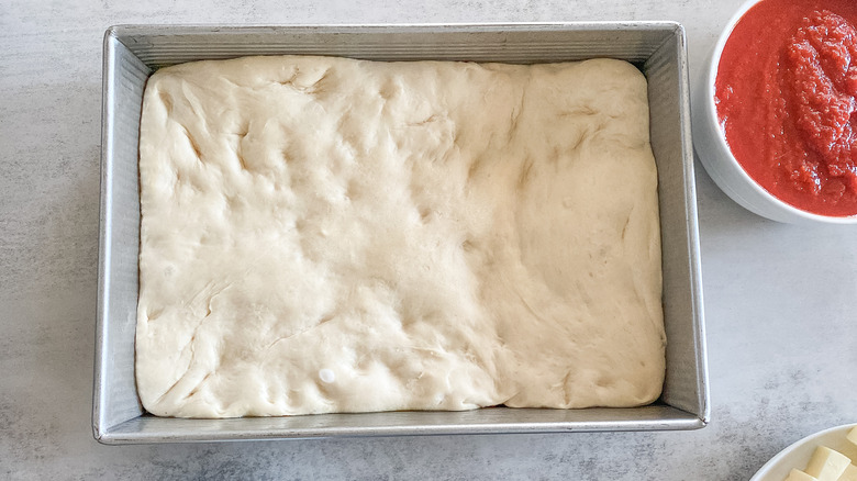 puffy dough in metal pan