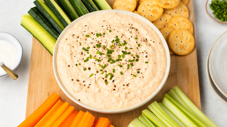 deviled egg dip with crackers and crudites