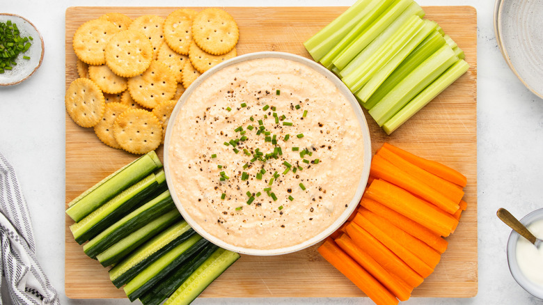 deviled egg dip with crackers and crudites