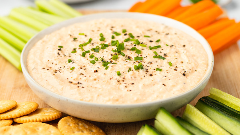 deviled egg dip with crackers and crudites