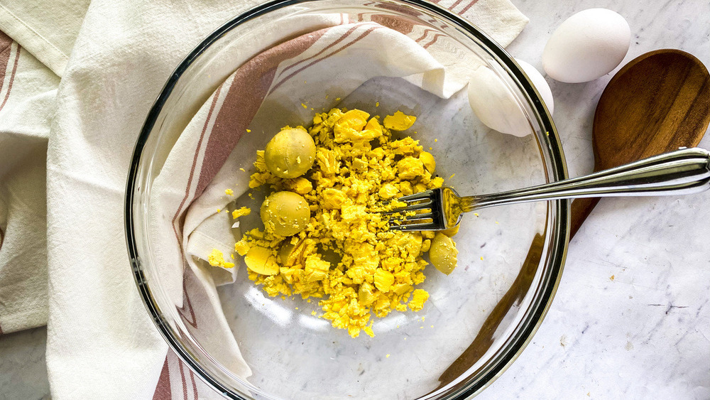 egg yolks in glass bowl