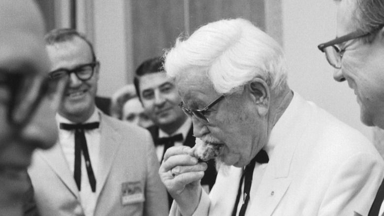 colonel sanders preparing fried chicken