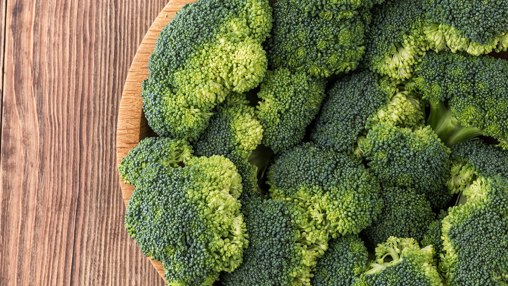 Broccoli florets in wooden bowl