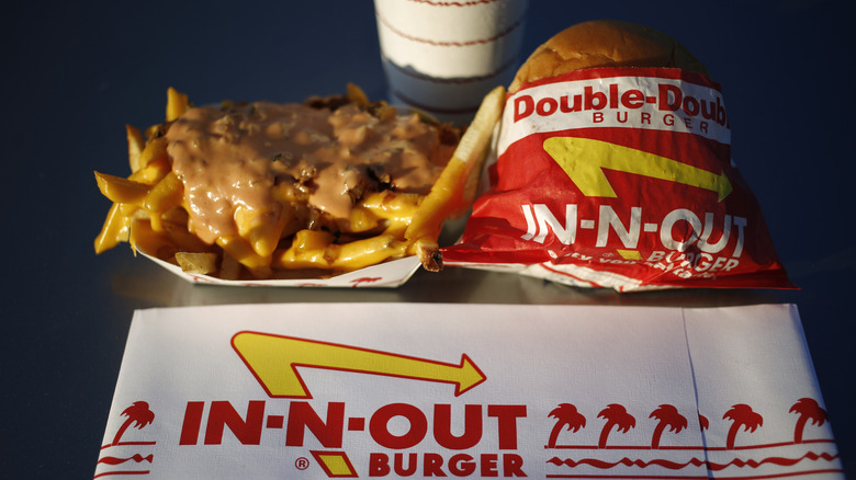 Double-double burger, animal fries, and drink 