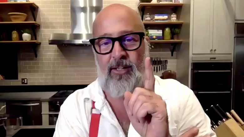 Andrew Zimmern with finger up