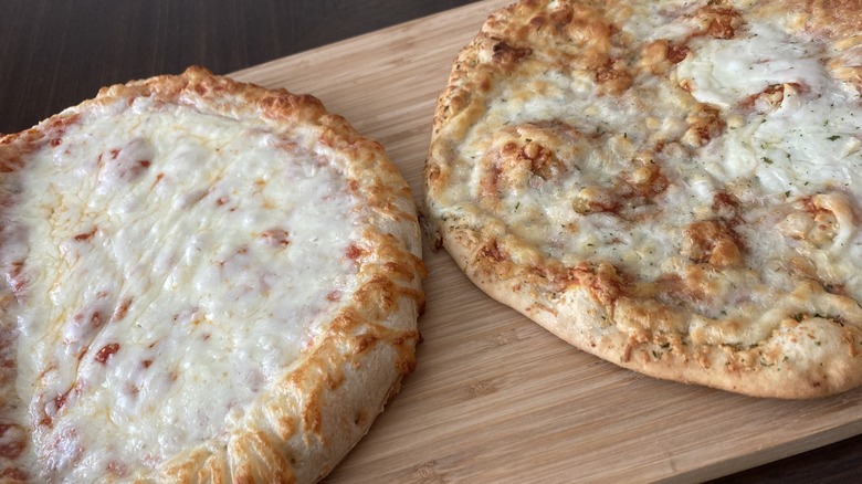 pizzas on serving board