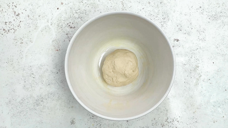 pizza dough in mixing bowl