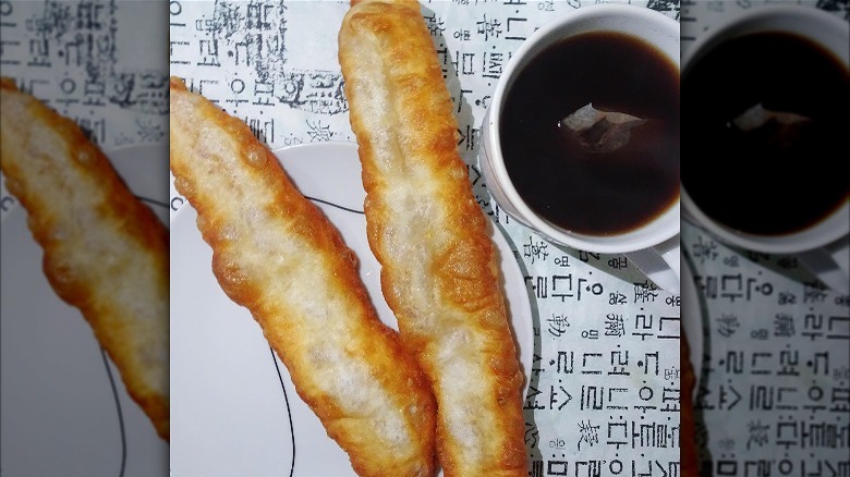 Cruller sticks with tea cup 